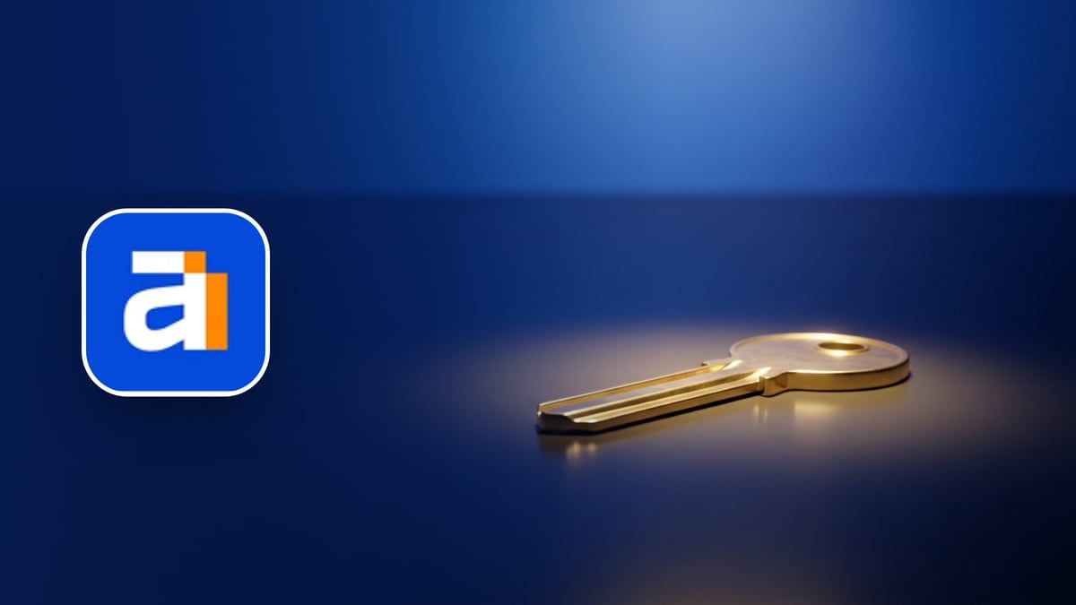 Ahrefs icon beside a laptop showing a pricing page and a voucher